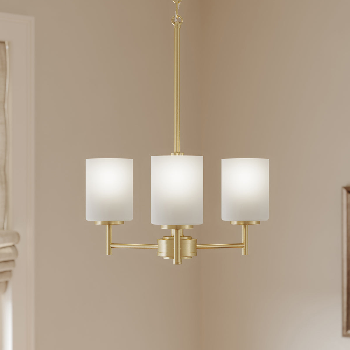 Modern chandelier with three light fixtures on a beige wall. 