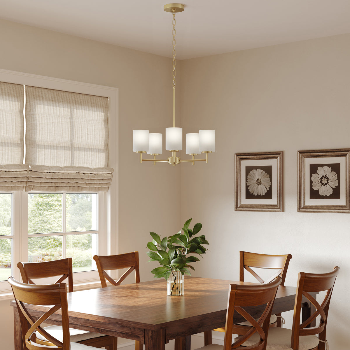 Dining room with wooden table and chairs, chandelier, and framed artwork on the wall. 