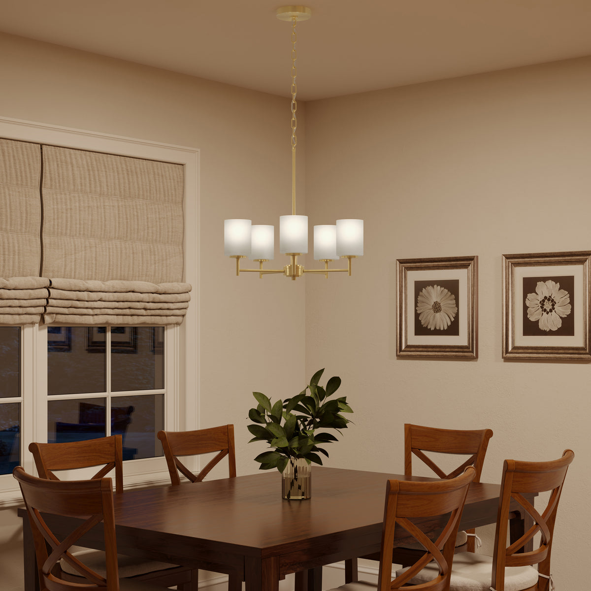 Dining room with wooden table and chairs, chandelier, and framed artwork on the wall. 