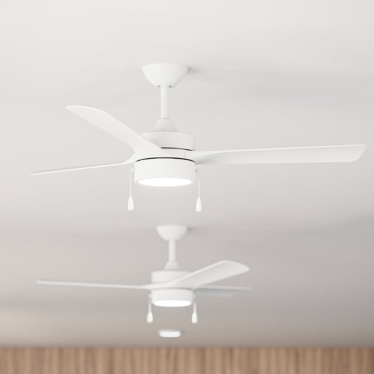 Closeup of P250122-28M-30 ceiling fans on a white ceiling with wooden paneling. 