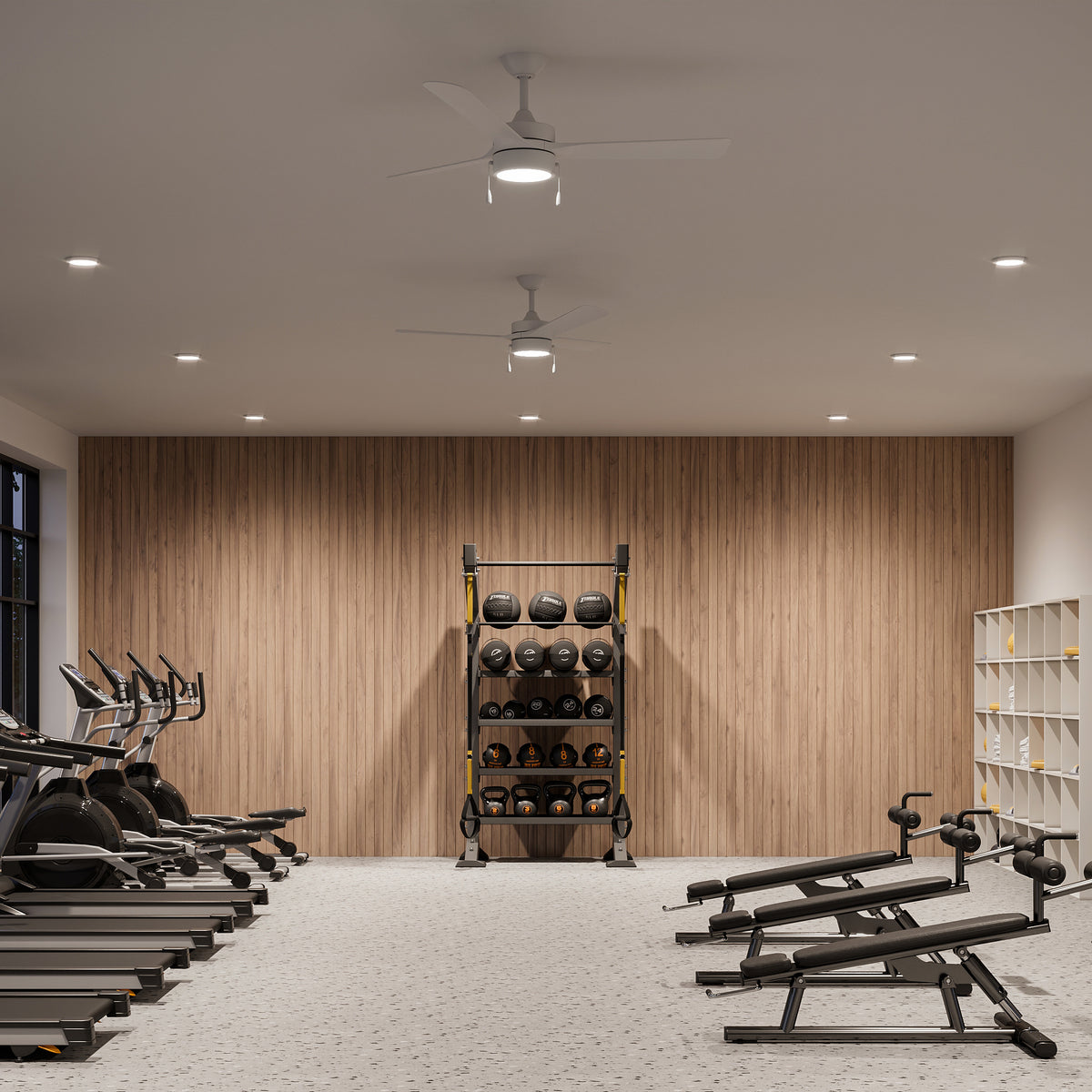 Gym interior with P250122-28M-30 ceiling fans with cardio machines, weight rack, and weight bench against a wooden wall. 