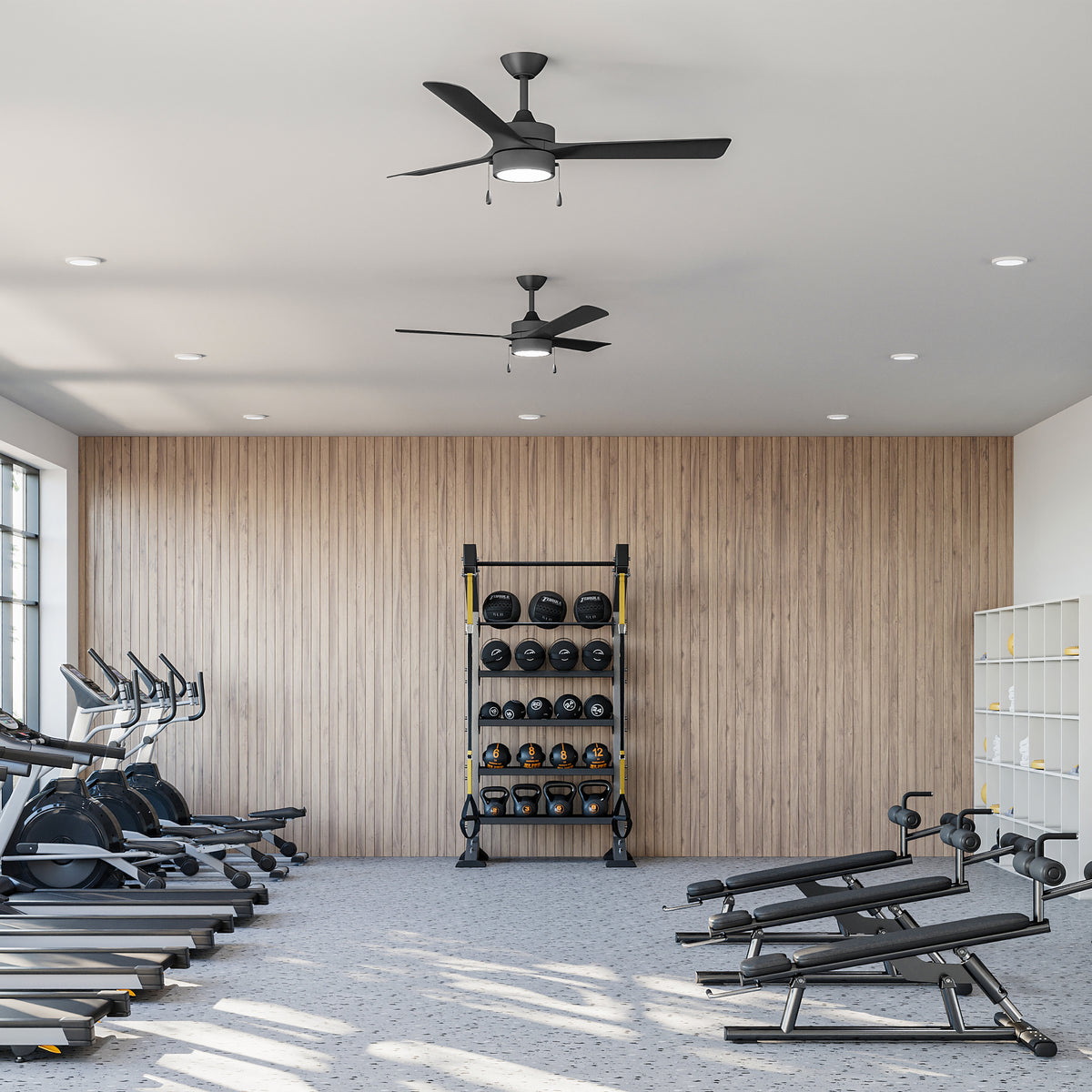 Gym interior with P250122-31M-30 ceiling fans with exercise equipment including treadmills, weight racks, and benches. 