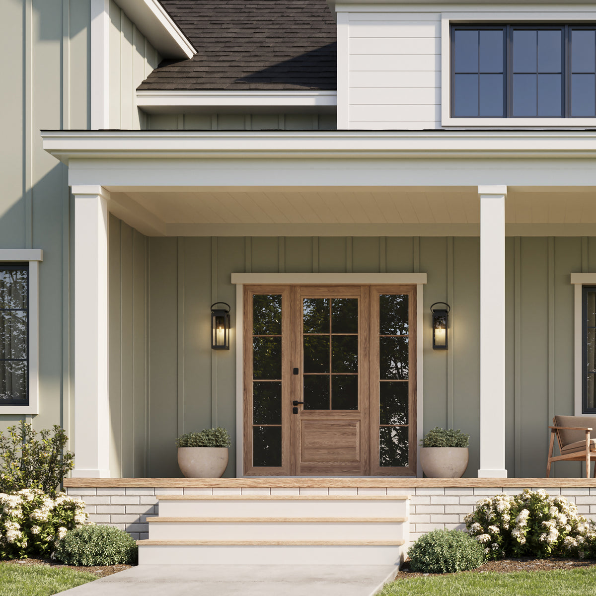 Front view of a house with a wooden door and porch lights.
