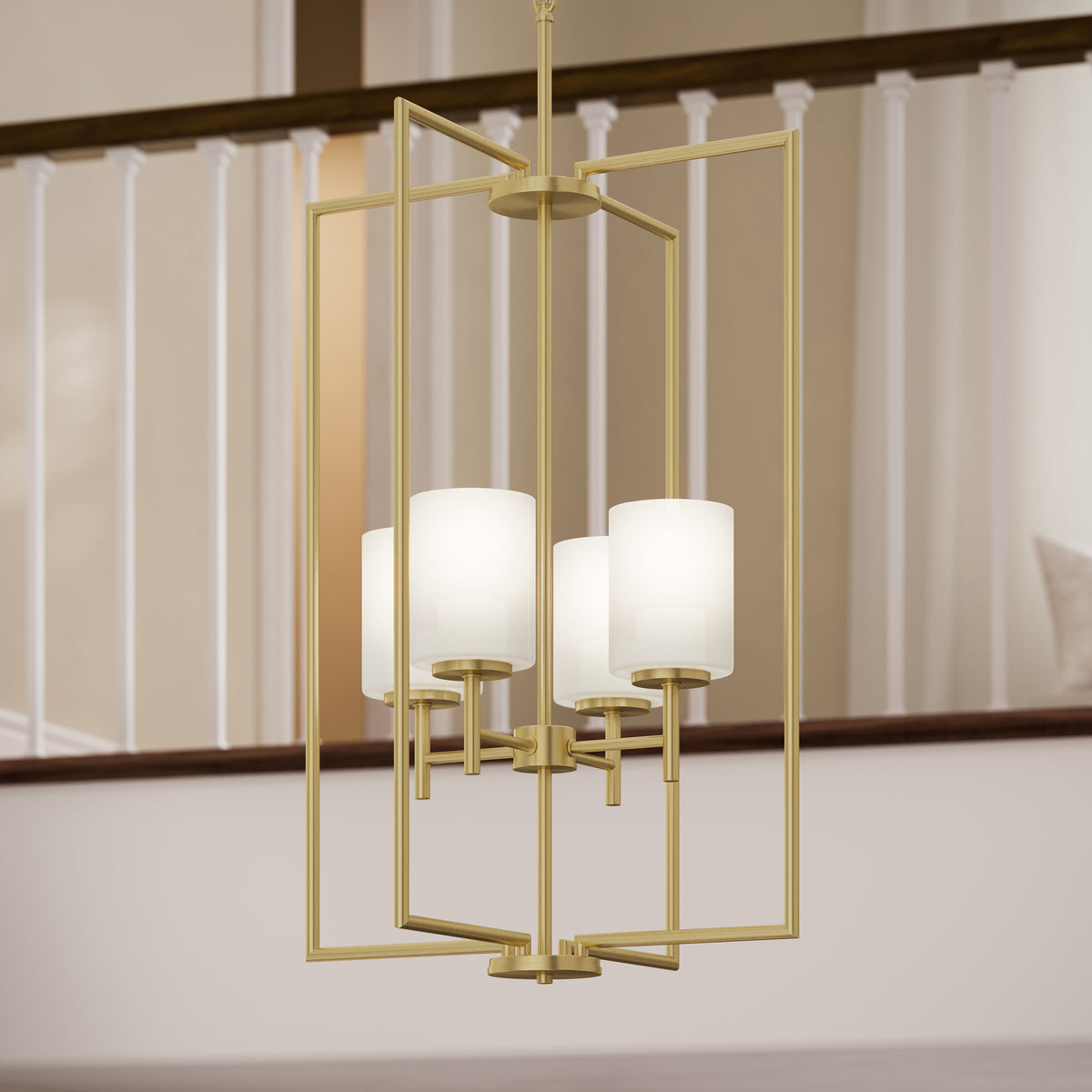 Gold chandelier with white lampshades in a room with a staircase.